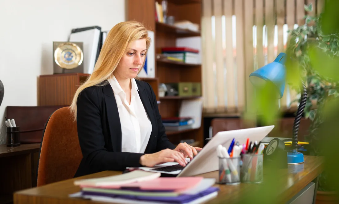 Administrative professional working at a desk
