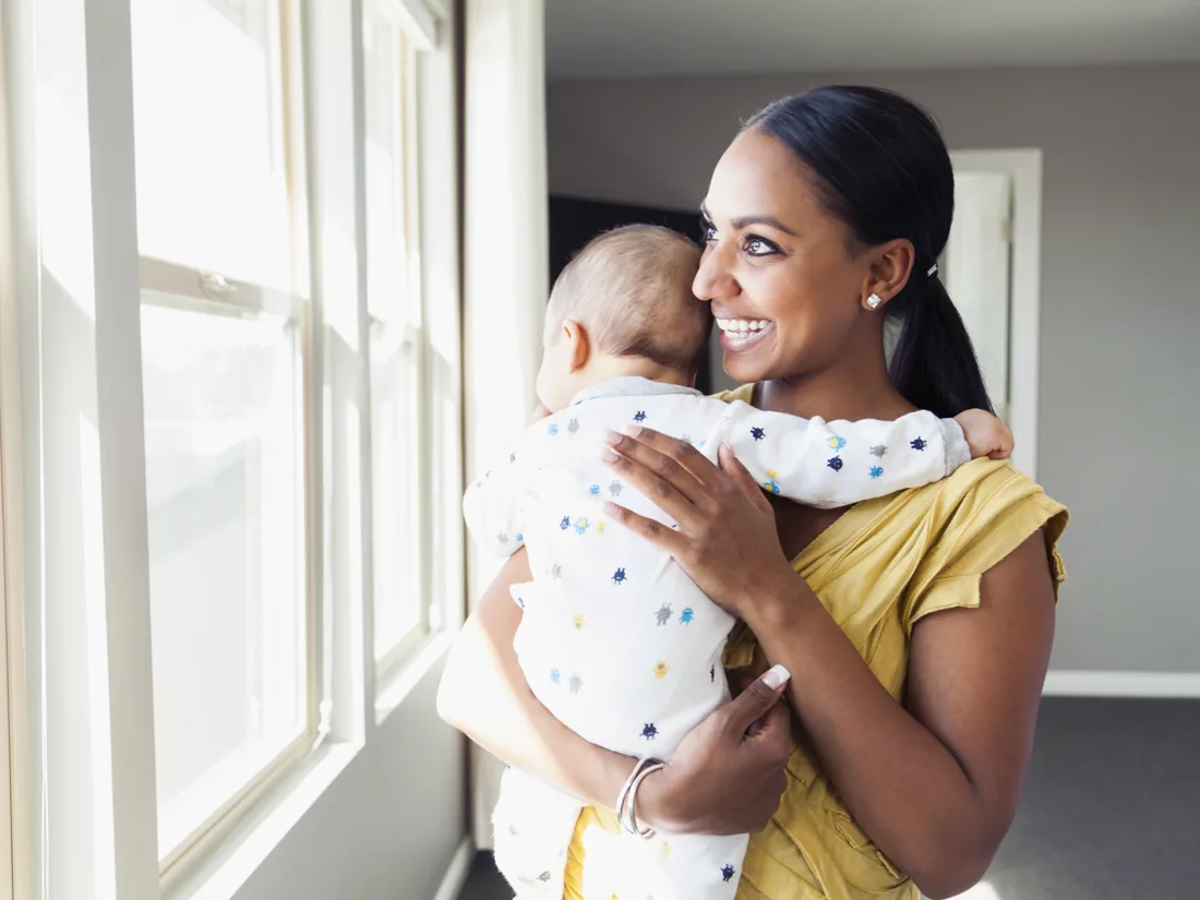 Caregiver holding a young child
